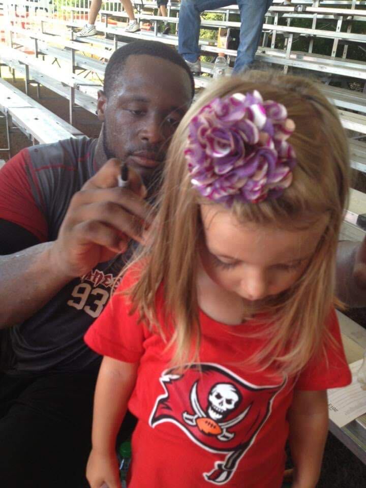 Former Tampa Bay Buccaneers defender Gerald McCoy signing my daughter's shirt after training camp practice in 2013.